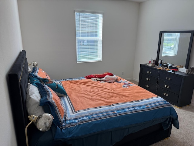 bedroom with light colored carpet