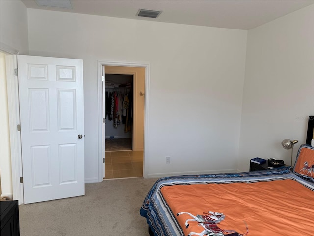 carpeted bedroom with a closet