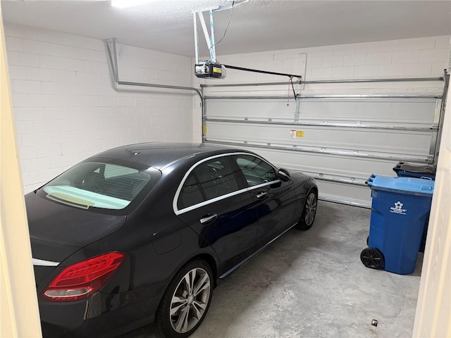 garage featuring a garage door opener