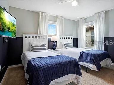 bedroom with carpet flooring and ceiling fan