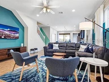 living room featuring ceiling fan