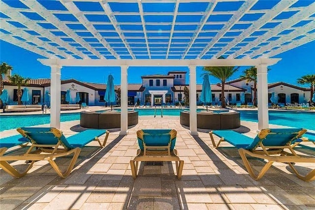 view of patio with a pergola and a community pool