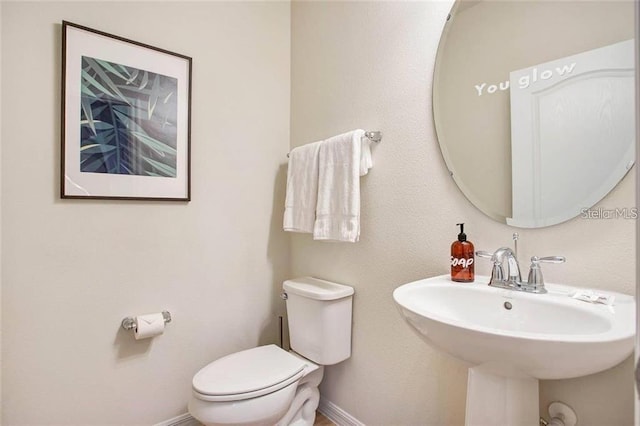 bathroom with sink and toilet