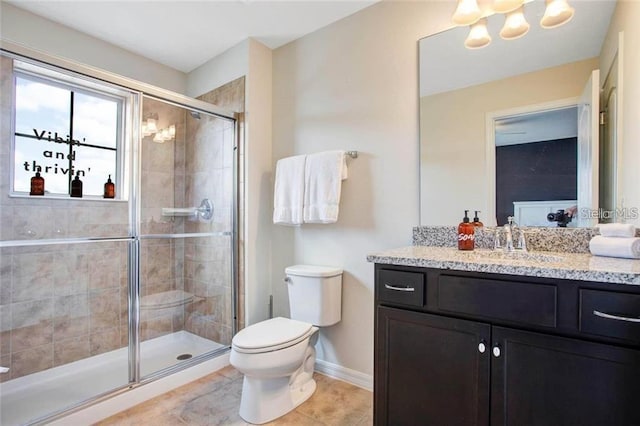 bathroom with toilet, vanity, an enclosed shower, and tile patterned flooring