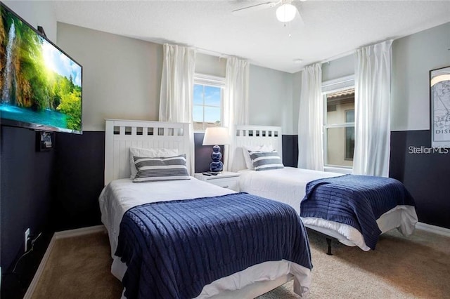 carpeted bedroom with ceiling fan