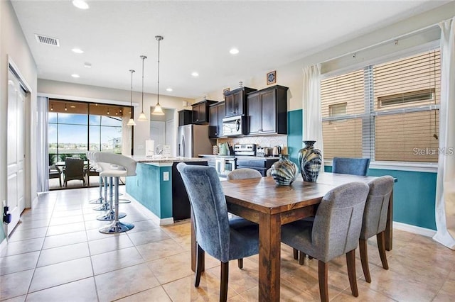 dining room with light tile patterned flooring