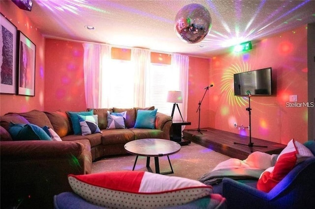 carpeted living room featuring a textured ceiling