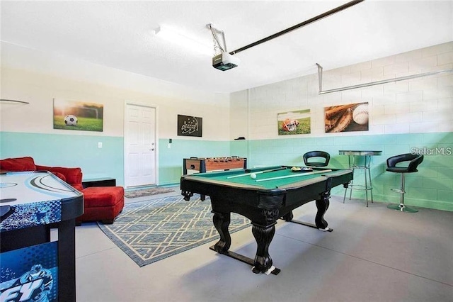 rec room featuring concrete flooring and billiards