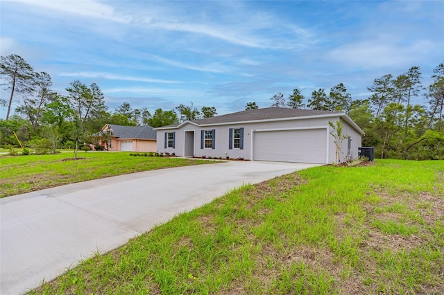 single story home with a garage, cooling unit, and a front yard