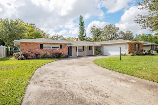 ranch-style house with a garage and a front lawn