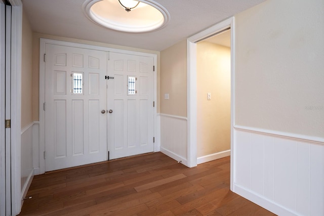 entrance foyer featuring wood-type flooring and a textured ceiling