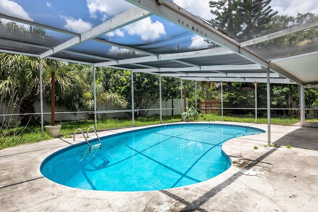 view of pool with a lanai and a patio