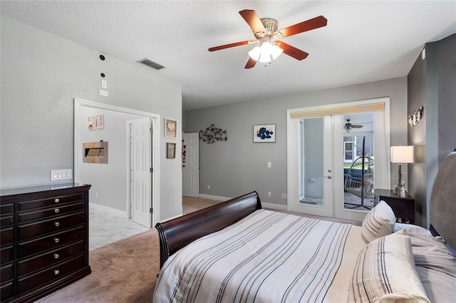 carpeted bedroom featuring access to outside, a textured ceiling, ceiling fan, and french doors