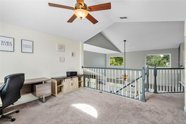 office area with vaulted ceiling, ceiling fan, and carpet floors