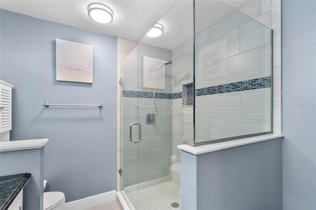 bathroom with a textured ceiling, toilet, and an enclosed shower