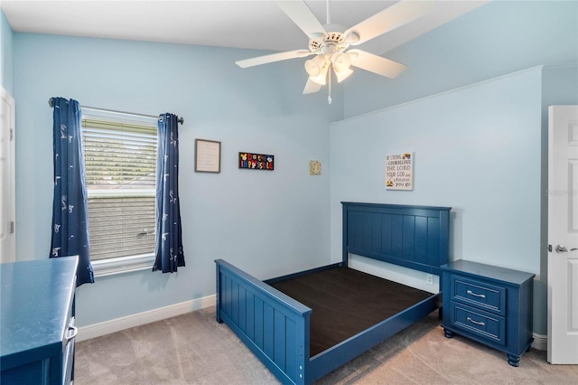 carpeted bedroom with lofted ceiling and ceiling fan