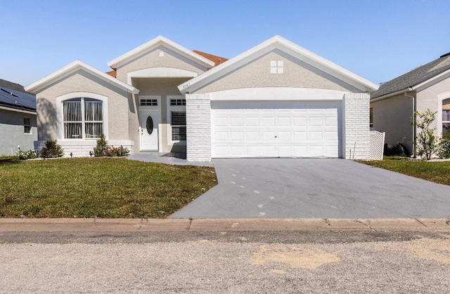 view of front of home with a garage and a front yard