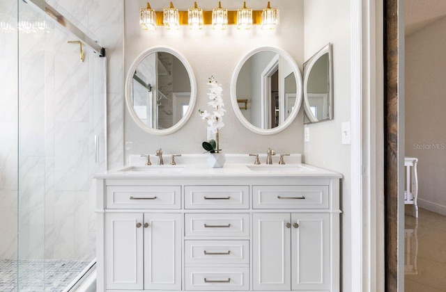 bathroom featuring vanity and tiled shower