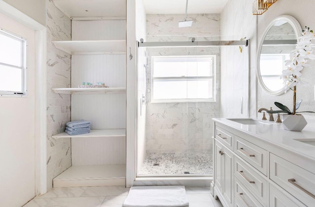 bathroom featuring vanity and an enclosed shower