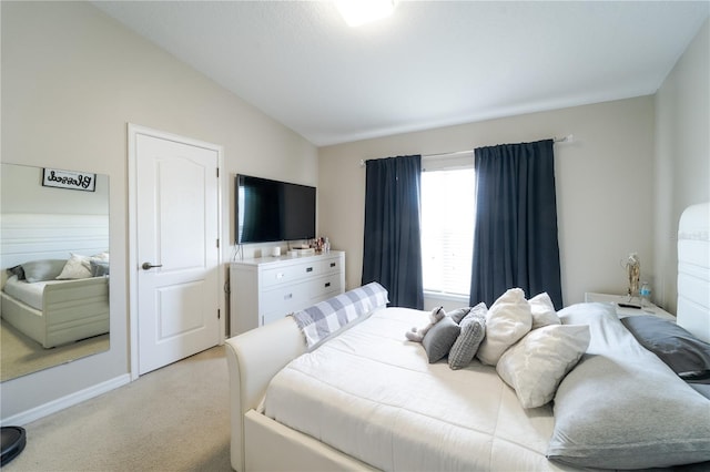 carpeted bedroom featuring vaulted ceiling