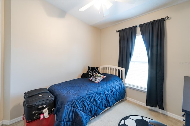 carpeted bedroom featuring ceiling fan