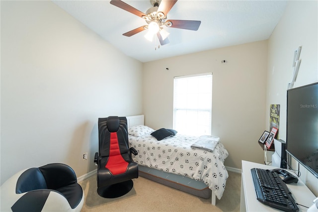 bedroom with ceiling fan and light carpet