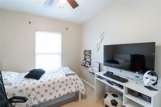 bedroom featuring light carpet and ceiling fan