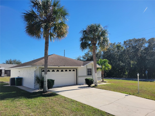 single story home featuring a front lawn and a garage