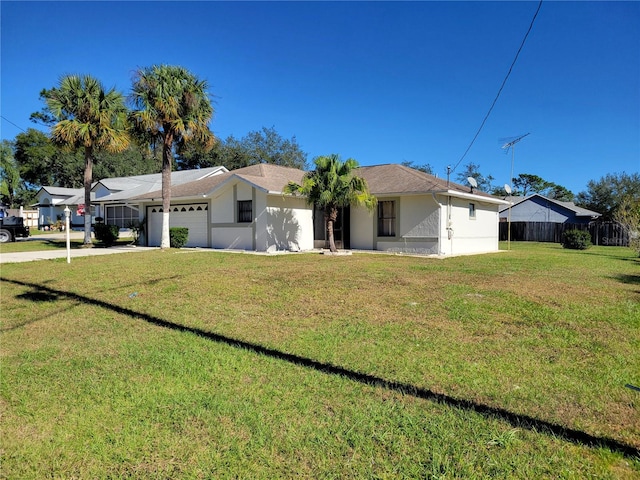 ranch-style home with a front yard and a garage