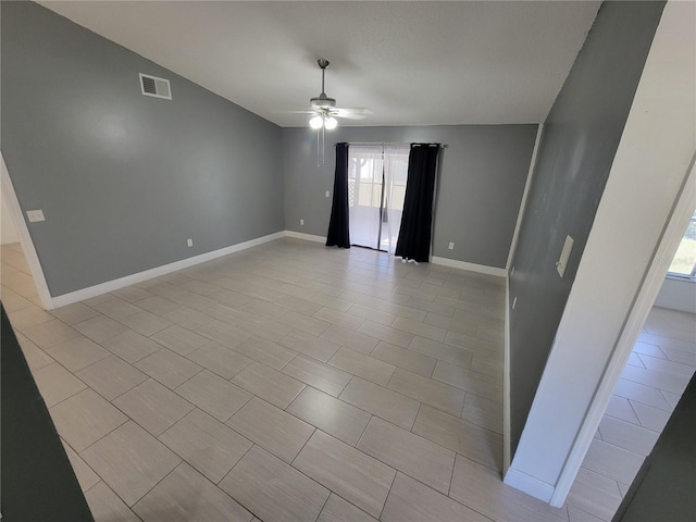 spare room with ceiling fan and lofted ceiling