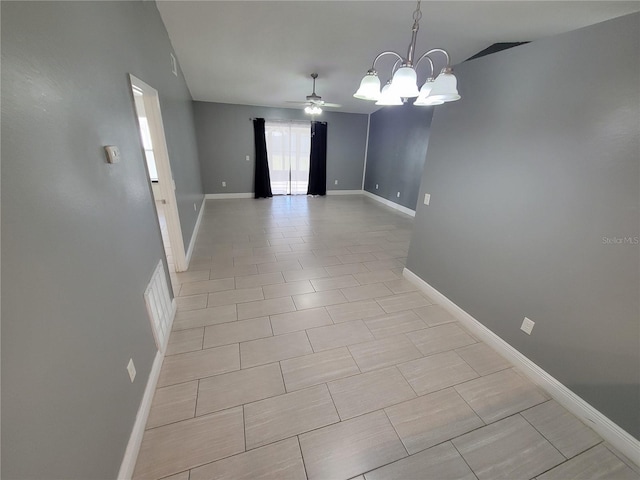 interior space with ceiling fan with notable chandelier and lofted ceiling