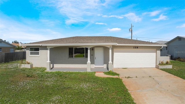 ranch-style home with a porch, a garage, and a front lawn