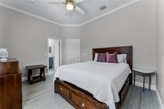 bedroom featuring light hardwood / wood-style flooring, ornamental molding, ceiling fan, and ensuite bath