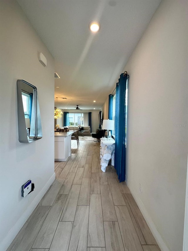 hallway featuring light hardwood / wood-style flooring