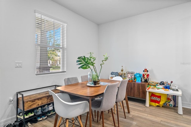 dining space featuring light hardwood / wood-style flooring