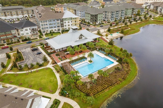 birds eye view of property with a water view