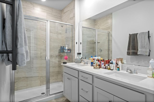 bathroom with walk in shower and vanity