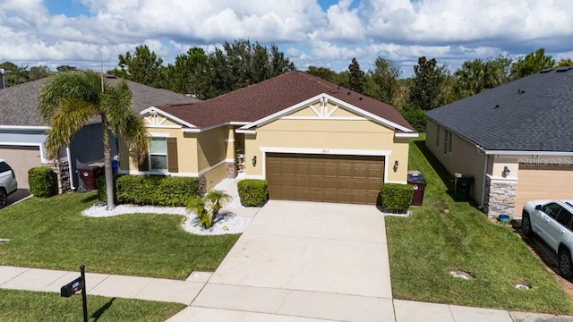 view of front facade featuring a garage and a front yard