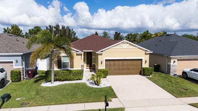 ranch-style home featuring a garage and a front lawn