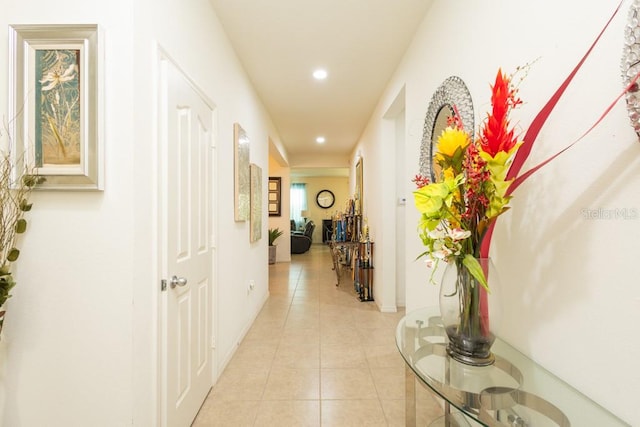 hall featuring light tile patterned floors