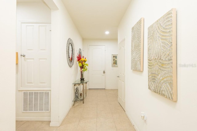 corridor with light tile patterned floors