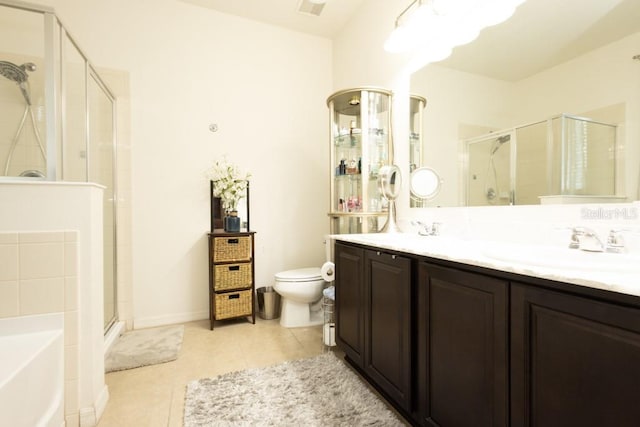 full bathroom with vanity, tile patterned floors, shower with separate bathtub, and toilet