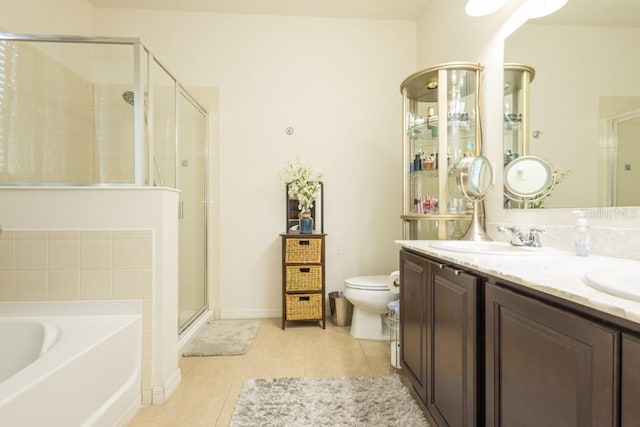 full bathroom with toilet, vanity, tile patterned flooring, and separate shower and tub