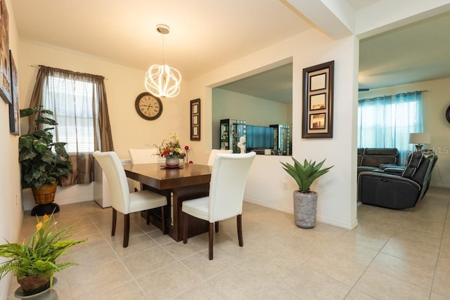 dining area with a notable chandelier and light tile patterned floors