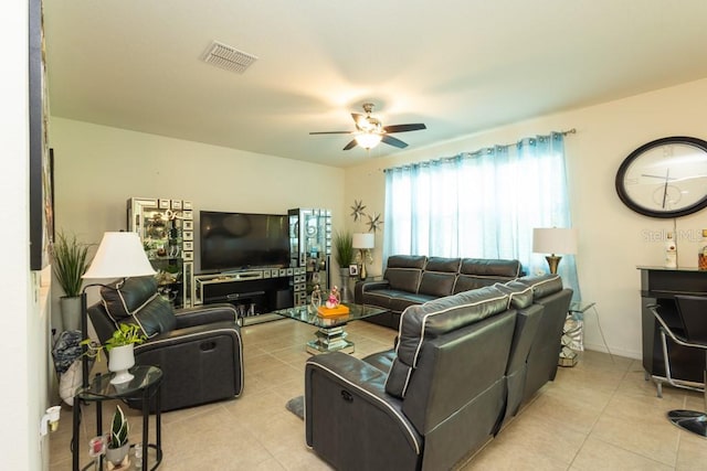 living room featuring ceiling fan and light tile patterned floors