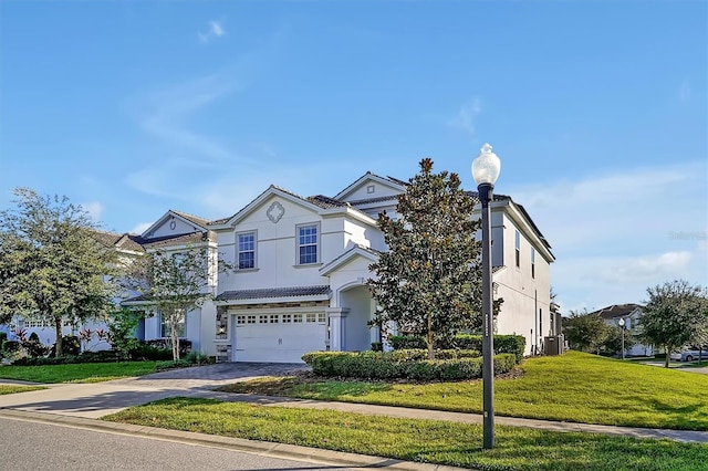 view of front of property featuring a garage and a front yard