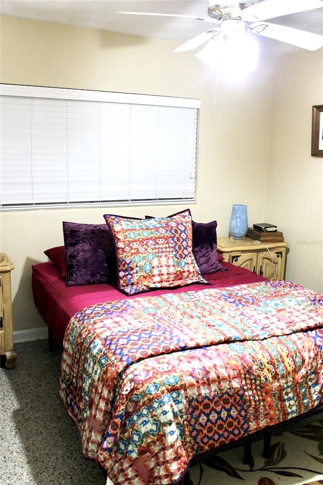 bedroom featuring ceiling fan and carpet floors