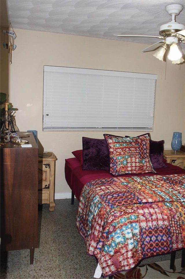 bedroom with a textured ceiling and ceiling fan