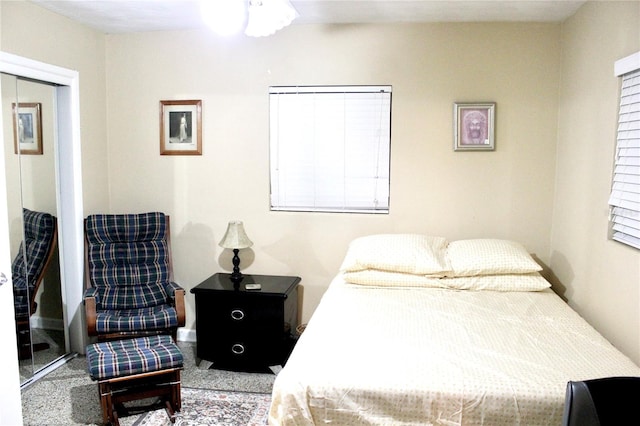 carpeted bedroom with a closet