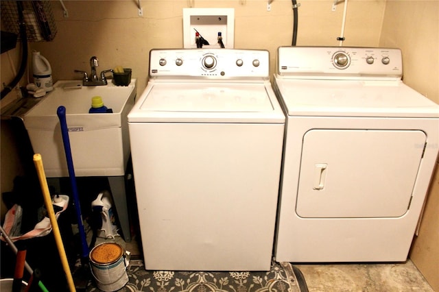 laundry room with washing machine and clothes dryer